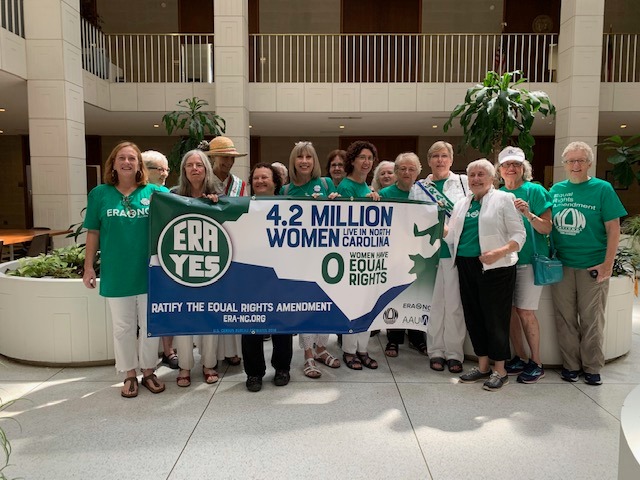 Women in green and white with a banner of the August/Sept 2019 ERA Billboard.